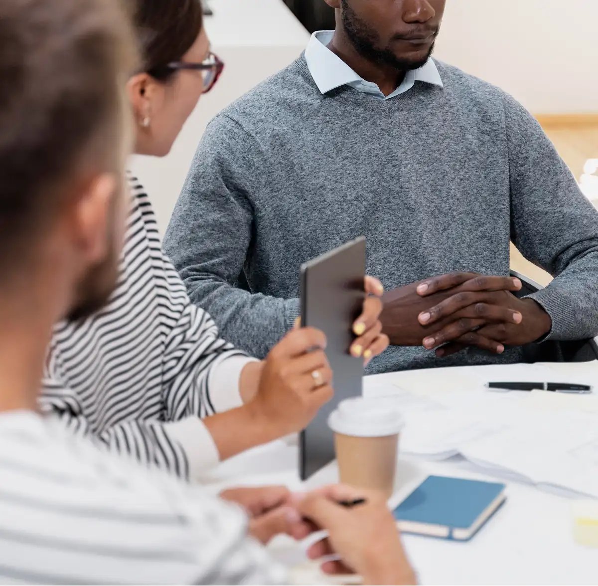 Colleagues in discussion during a team meeting
