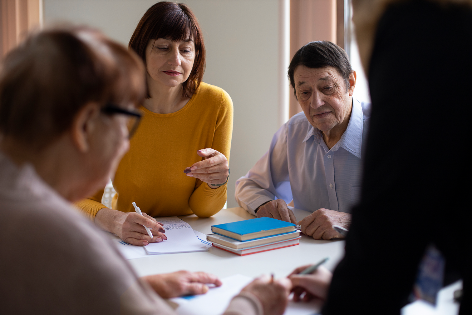 Business professionals reviewing documents together at a meeting table
