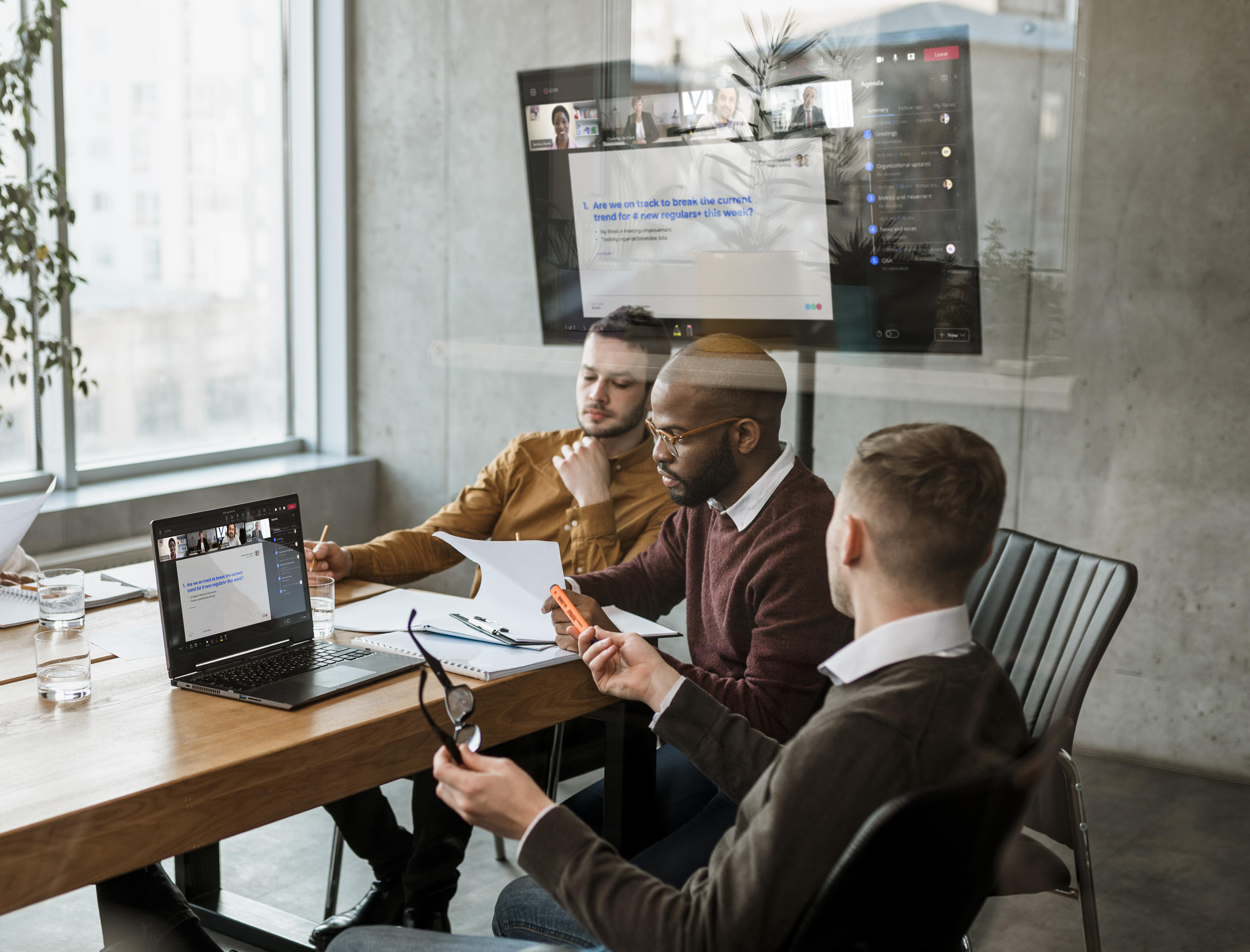 Professionals gathered around a table for a structured executive meeting